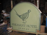 Hand painted double sided projecting sign